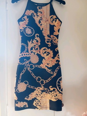 Black dress with yellow patterns like new, size XS