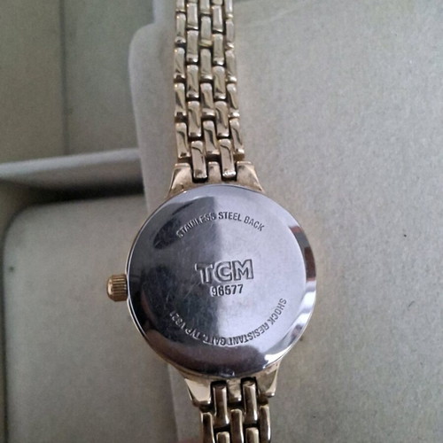 TCM women's watch used, gold-tone with minor scratch on glass