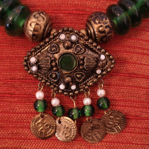 Handmade traditional vintage necklace with green beads and bronze details