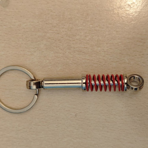 Shock absorber keychain, red