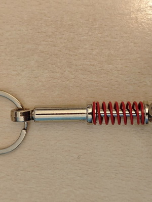 Shock absorber keychain, red