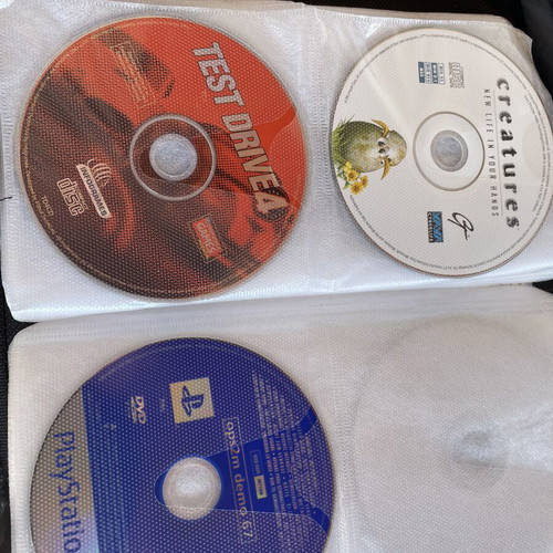 Vintage PC and PlayStation 2 gaming bundle with case, 70 CDs/DVDs