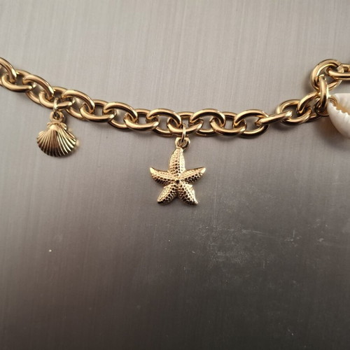 Stainless steel bracelet with gold-colored charms, new