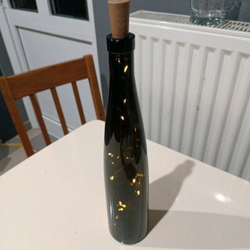 Bottle with cork and battery lights like new