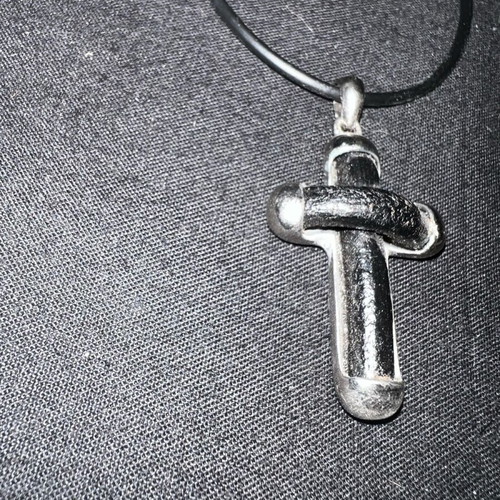 Silver cross with leather like new