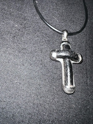 Silver cross with leather like new