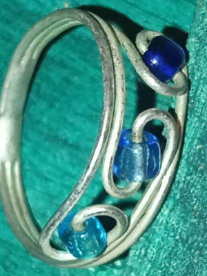 Ring used with blue beads and silver details