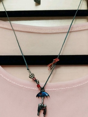 Necklace with cord couple under umbrella like new, blue