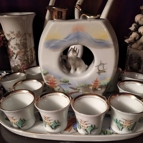 Japanese porcelain sake set used, 12 cups and carafe with tray