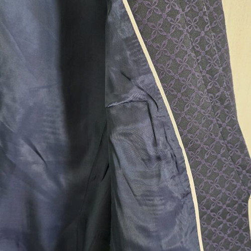 Black H&M jacket with three-quarter sleeve and purple embroidery size medium like new