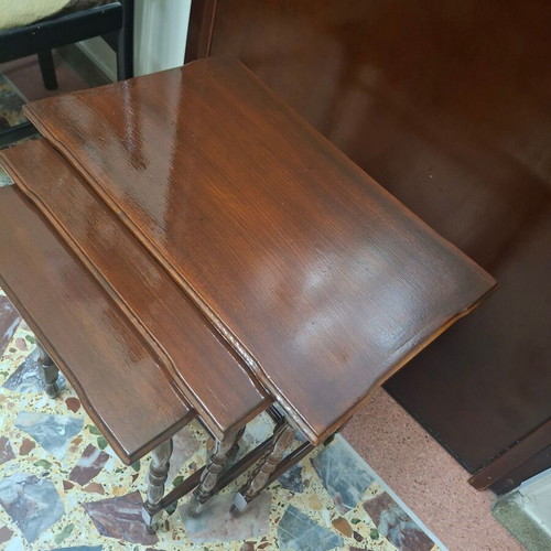 Set of three vintage wooden nesting tables, dark honey color