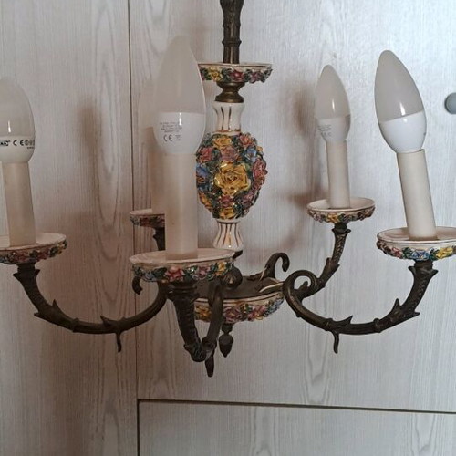 Vintage ceiling chandelier used with brass wall sconces and porcelain