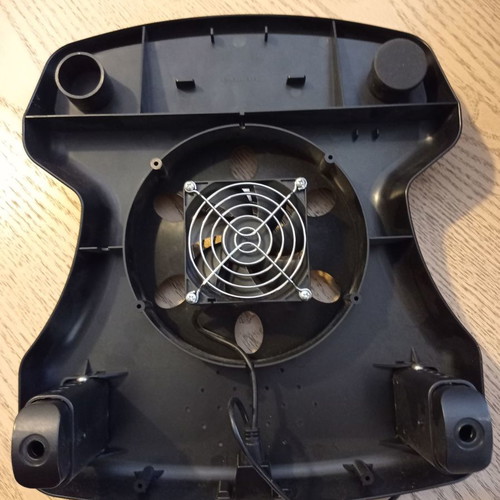 Laptop cooling stand used with fan
