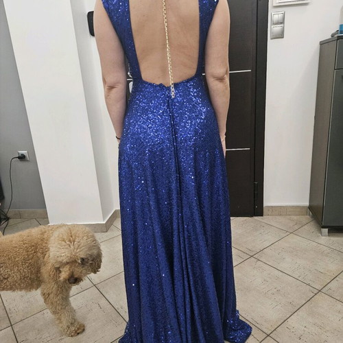 Diamond blue dress like new, open back with shoulder pads