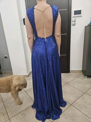 Diamond blue dress like new, open back with shoulder pads