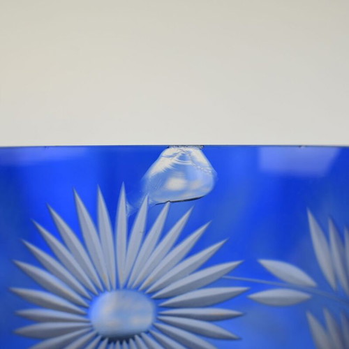 Blue crystal bowl used with cut glass sunflower and leaf design