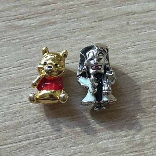Winnie the Pooh and Cruella de Vil charms used, silver set of 2