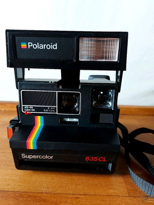 Polaroid Supercolor 635CL vintage instant camera used with strap