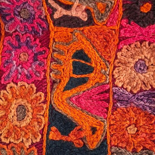 Handmade woven cover like new in red shades