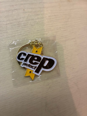 Crep Protect keychain accessory new, gold