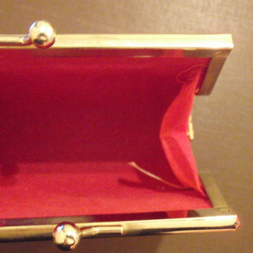 Small red wallet with gold clasp used