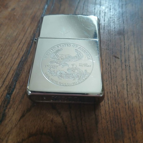 Zippo lighter used with embossed eagle emblem