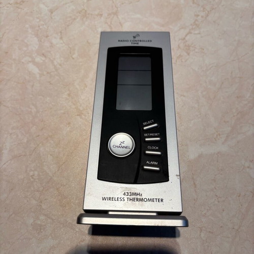 Wireless digital weather station used with radio-controlled clock