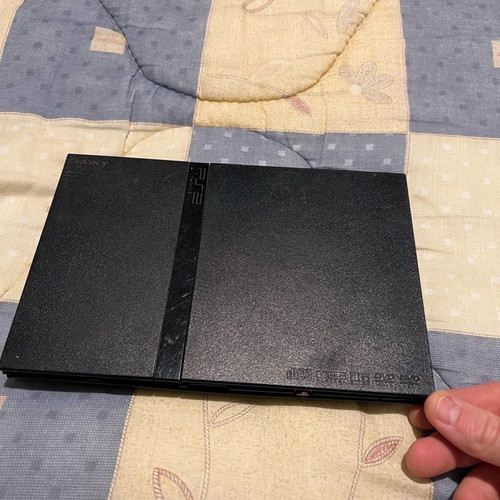 PlayStation 2 Slim used, functional without power cable