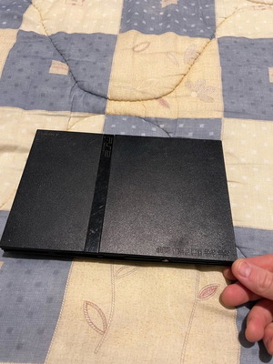 PlayStation 2 Slim used, functional without power cable