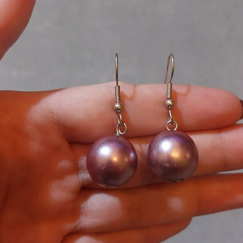 Dangling earrings used with purple and silver beads