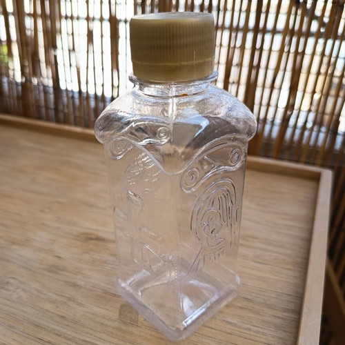 Holy water bottle like new with Christ and Virgin Mary figures