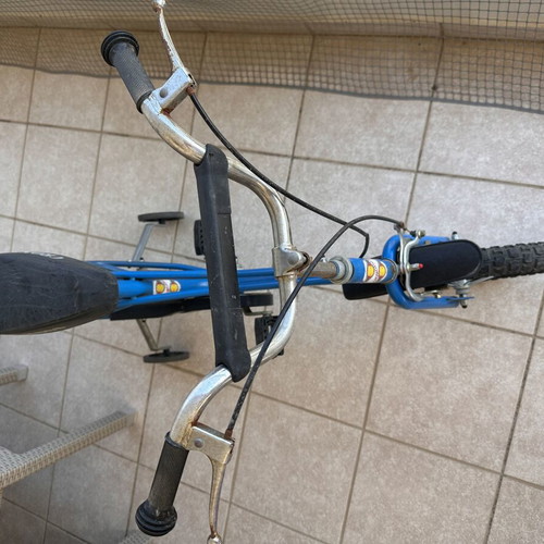 Vintage children's bike used, blue with training wheels for ages 5-7