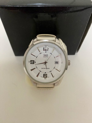 Quartz watch used, beige, needs strap replacement