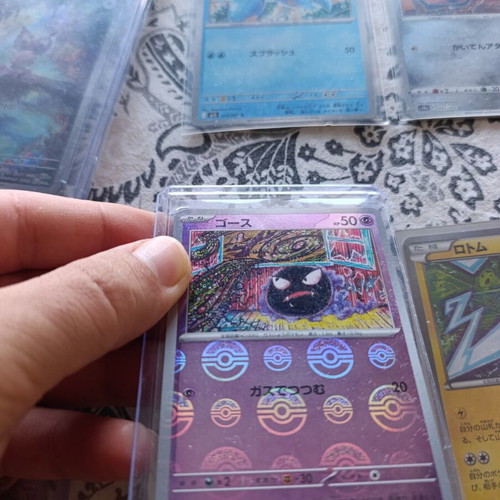 Japanese Pokemon TCG cards with 5 card stands