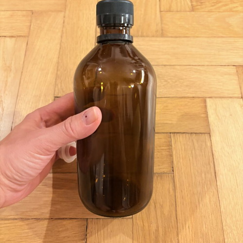 Brown glass pharmacy-style bottle with cap