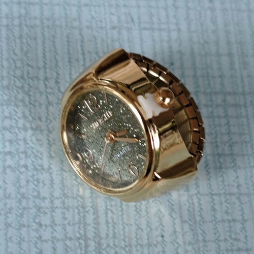 Ring watch quartz with khaki dial and gold bracelet like new
