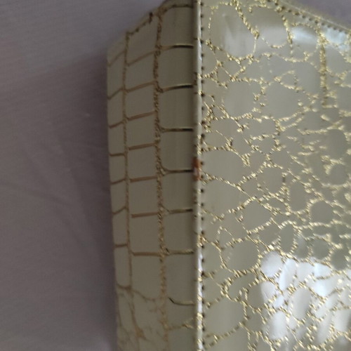 Small gold wristlet shoulder bag