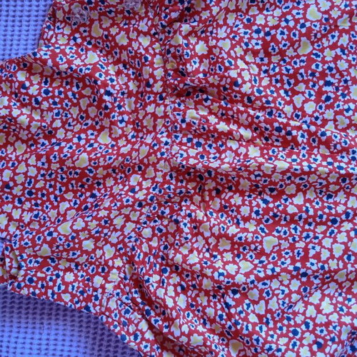 Red salopette with patterns for 3 years like new