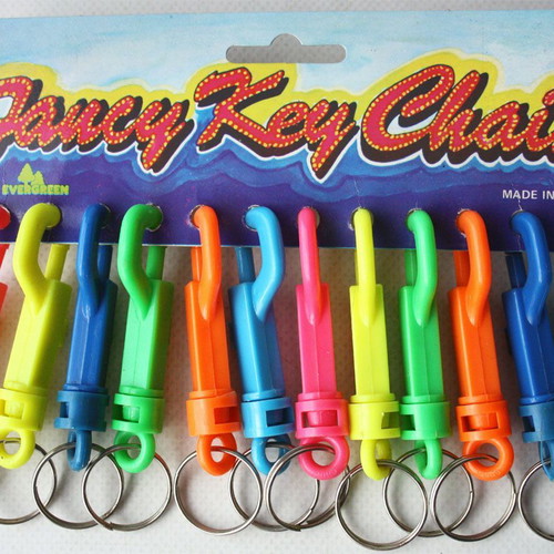 Card with 12 vintage 1980s phosphorescent key chains, new