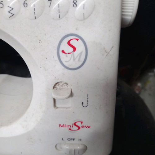 Mini sewing machine used for parts or decor, battery operated