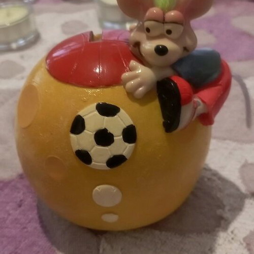 Ceramic piggy bank used with bottom opening