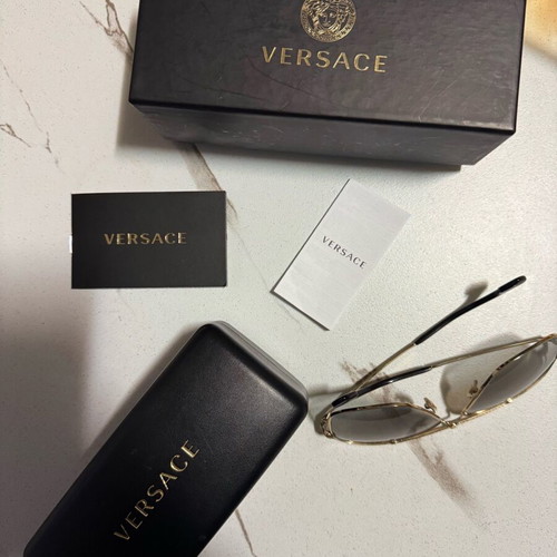 Versace Sunglasses like new, gold men's