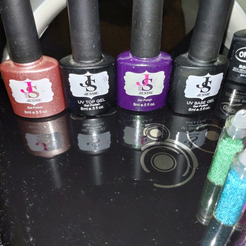 Sun nail lamp and 10 nearly full nail polishes