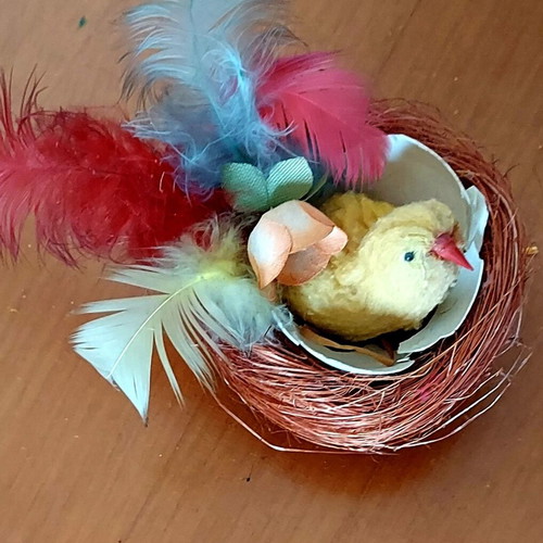 Vintage Easter nest used with yellow chick and colorful feathers