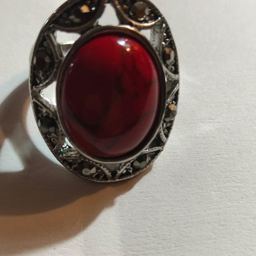 Silver-plated ring with red stone and small crystals new