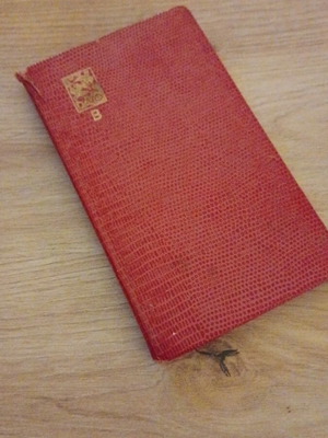 Stamp album used with approximately 125 stamps