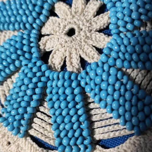 Handmade knitted doilies used with crochet and beads