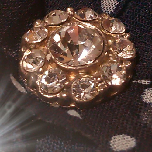 Hair accessory with blue and white flower and rhinestones