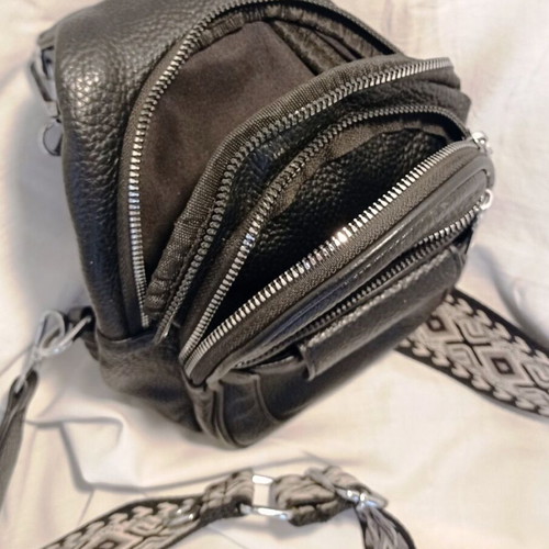 Black Sling Bag Crossbody backpack like new with wide strap and multiple pockets