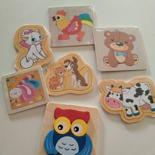Wooden puzzles new, sealed except owl